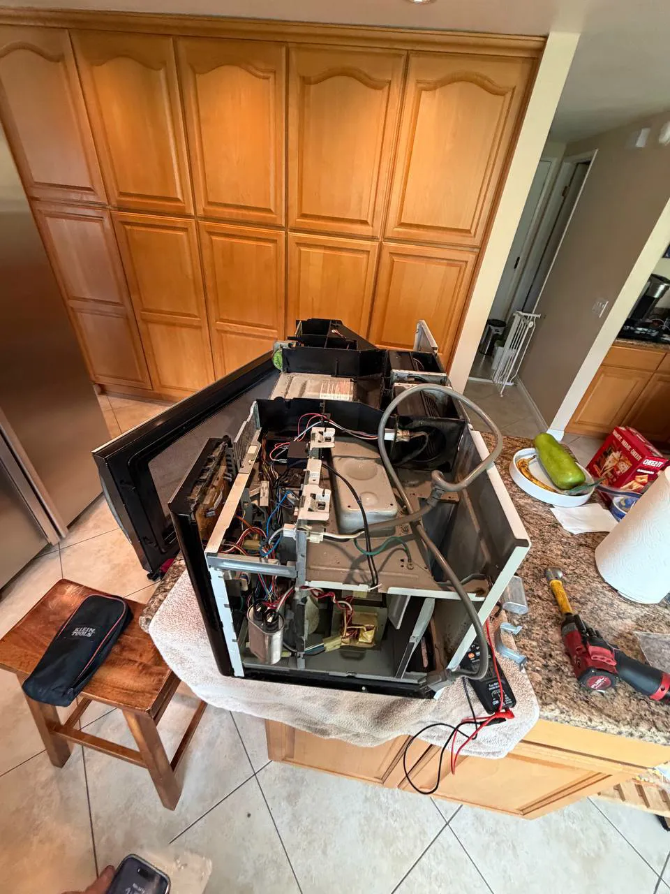 GE Monogram built-in microwave opened for a magnetron replacement